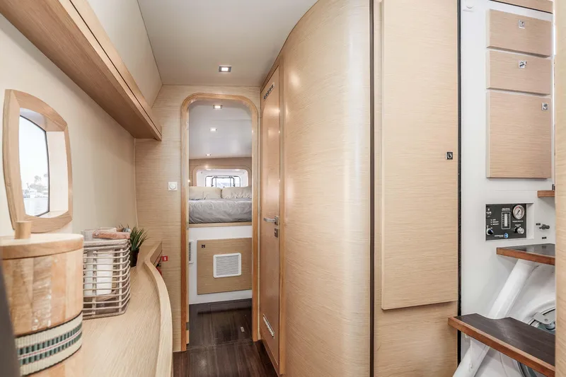  Yacht Photos Pics Interior of 2014 Outremer 51 yacht, featuring modern wood finishes and cozy cabin space.