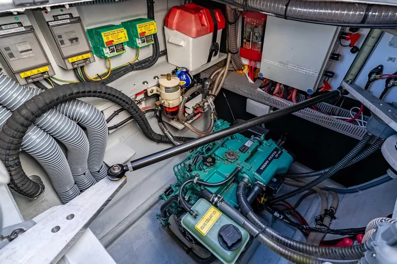  Yacht Photos Pics Engine room of a 2014 Outremer 51 catamaran, featuring Volvo Penta components and electrical systems.