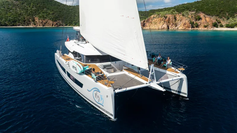 My Ty Yacht Photos Pics 2021 Fountaine Pajot Catamaran Alegria 67 sailing in clear blue waters.