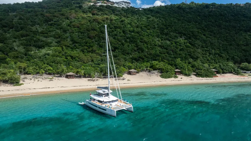 My Ty Yacht Photos Pics Fountaine Pajot Catamaran Alegria 67 sailing near lush tropical coastline, 2021 model.
