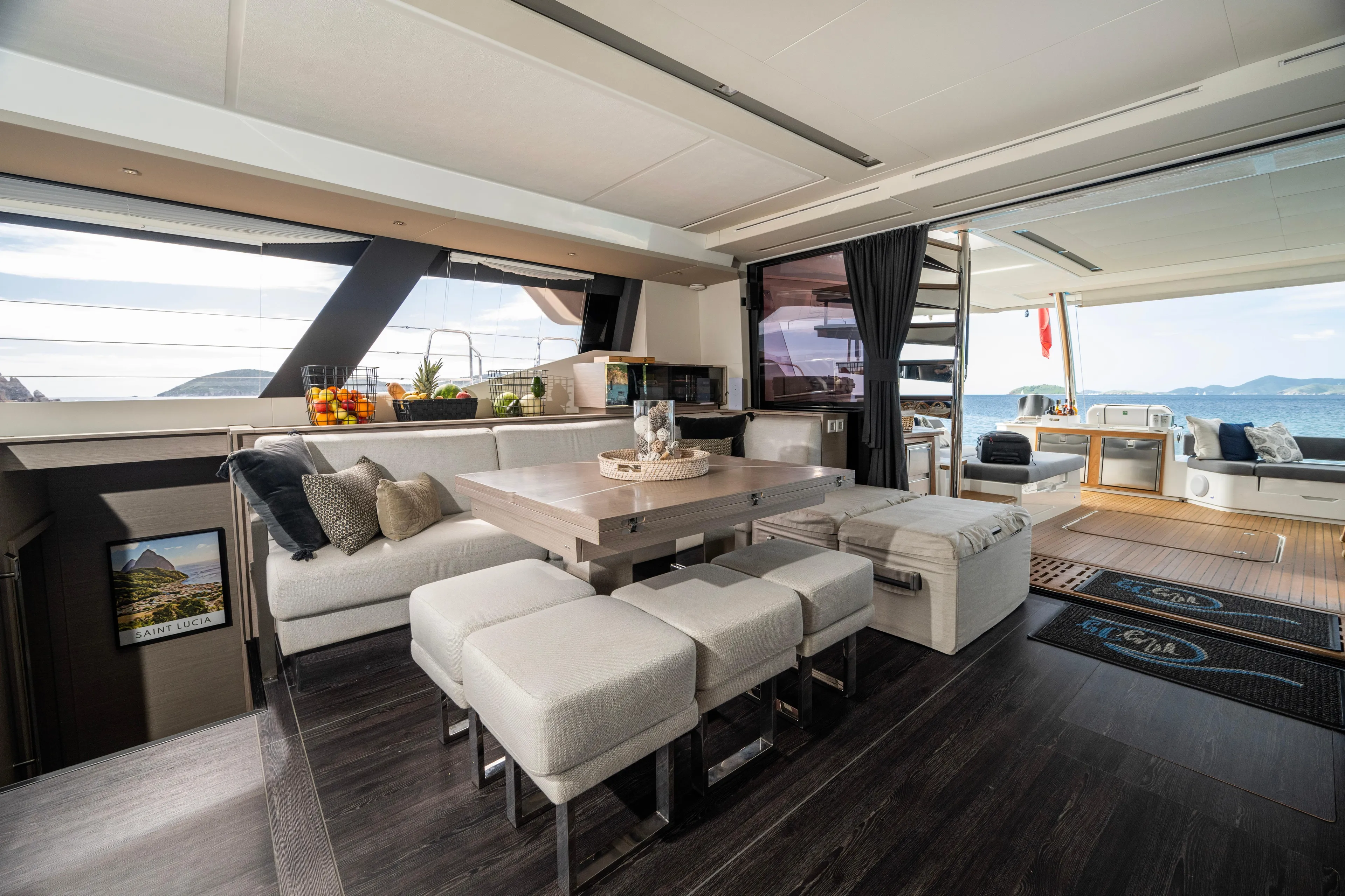 My Ty Yacht Photos Pics Luxurious interior of 2021 Fountaine Pajot Catamaran Alegria 67 with modern dining area.