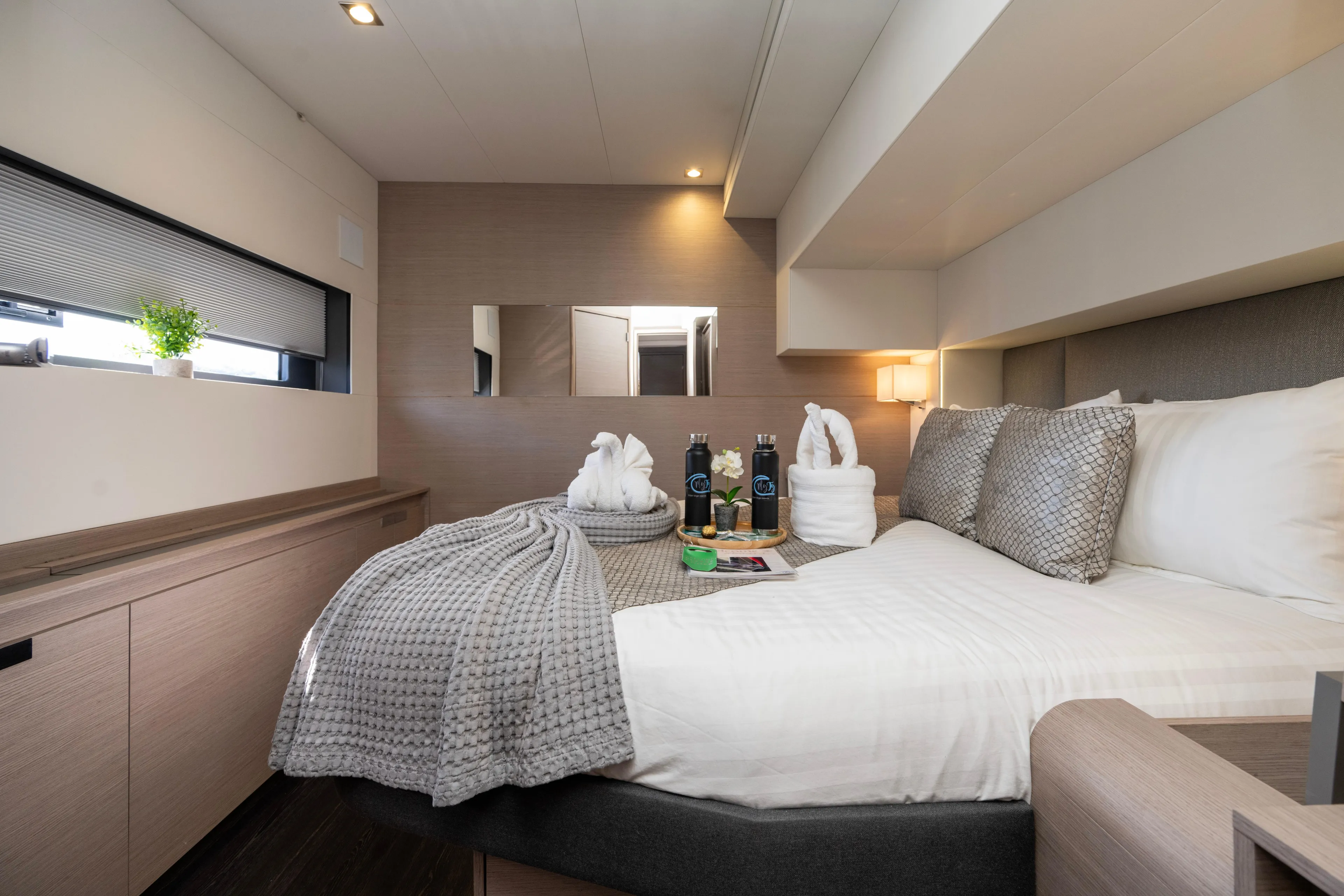 My Ty Yacht Photos Pics Luxurious bedroom interior of 2021 Fountaine Pajot Catamaran Alegria 67 with elegant decor.