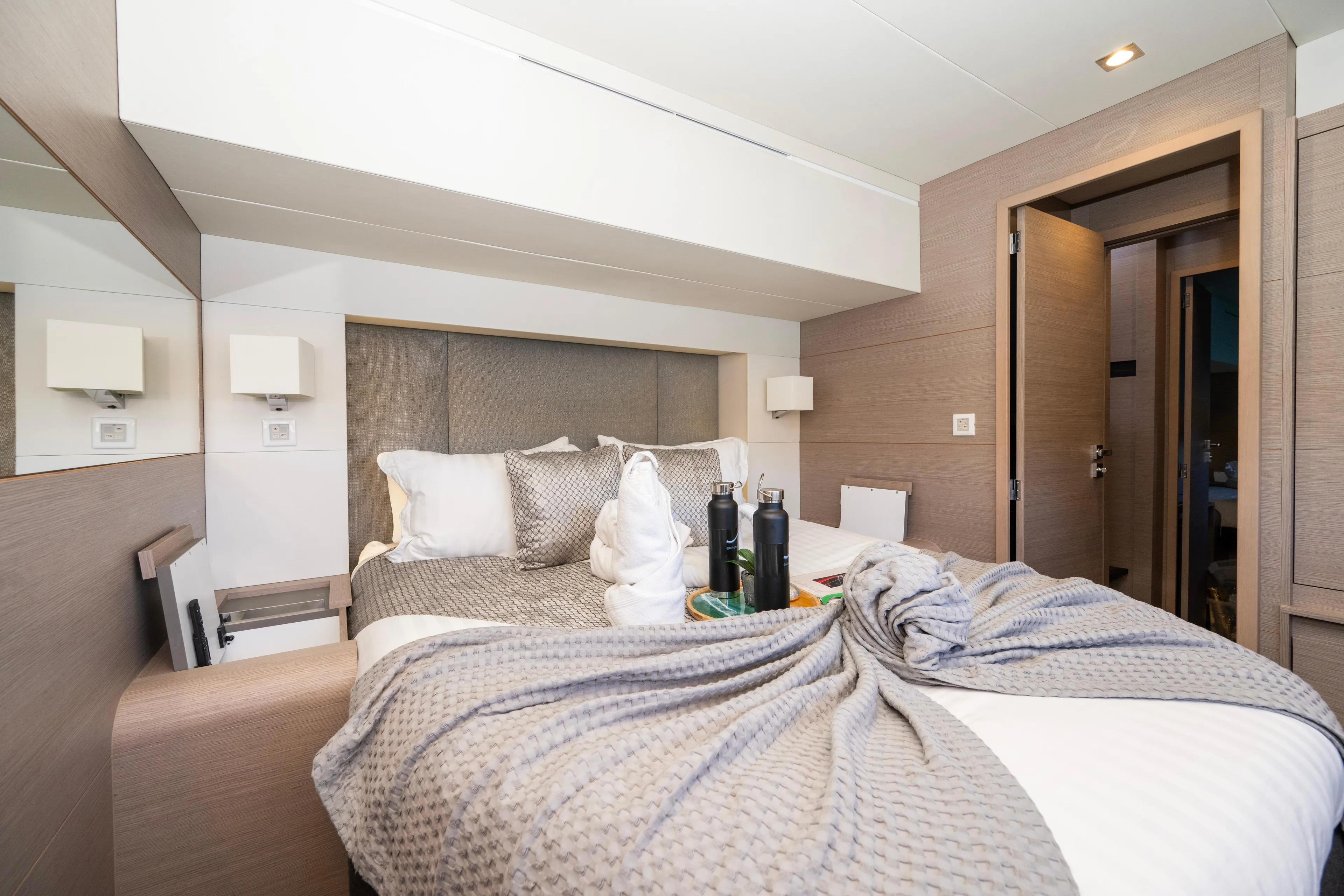 My Ty Yacht Photos Pics Luxurious bedroom interior of 2021 Fountaine Pajot Catamaran Alegria 67 with elegant decor.