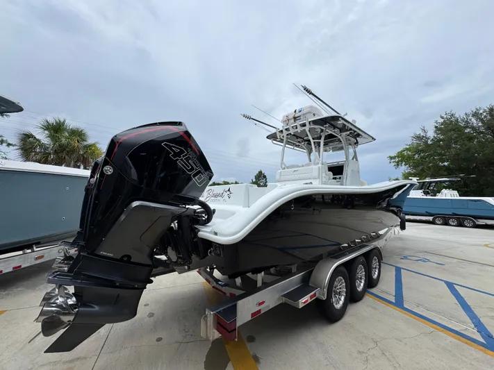  Yacht Photos Pics 2021 Yellowfin 36 Offshore boat on trailer with powerful outboard engine.