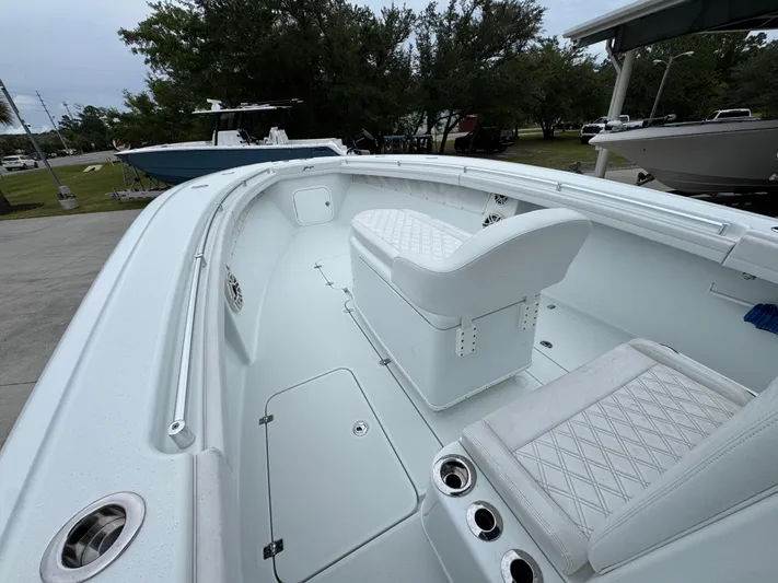  Yacht Photos Pics 2021 Yellowfin 36 Offshore boat interior with white seating and spacious deck.