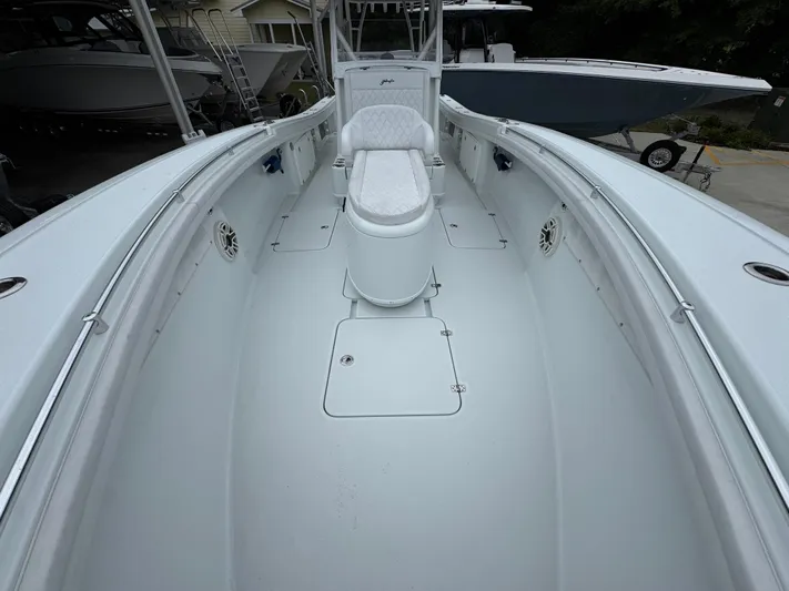  Yacht Photos Pics 2021 Yellowfin 36 Offshore boat interior with white seating and spacious deck.