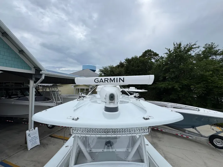  Yacht Photos Pics 2021 Yellowfin 36 Offshore boat with Garmin radar, docked under cloudy skies.