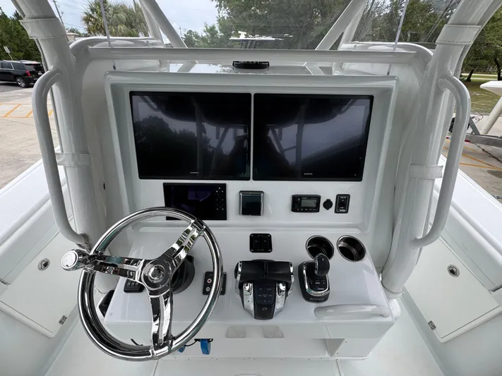  Yacht Photos Pics 2021 Yellowfin 36 Offshore boat console with dual screens and steering wheel.