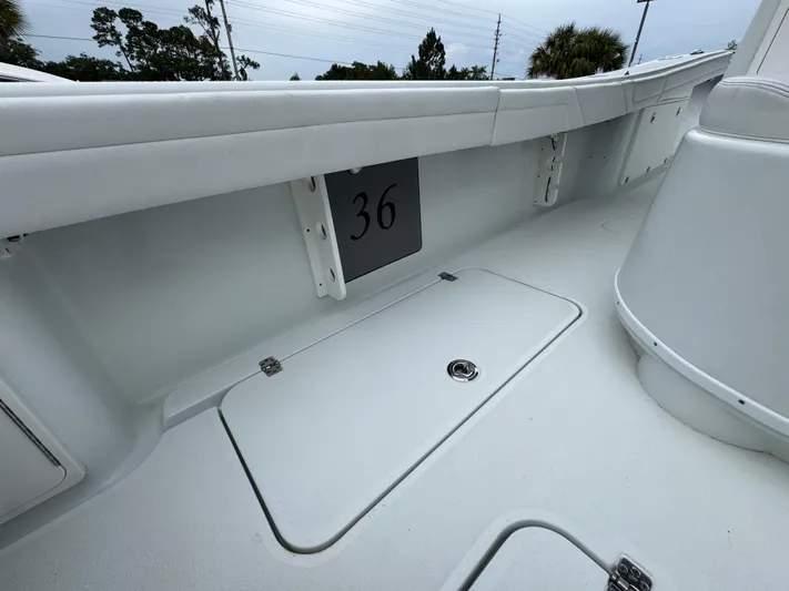  Yacht Photos Pics 2021 Yellowfin 36 Offshore boat interior with storage compartment and sleek design.
