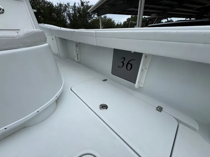  Yacht Photos Pics 2021 Yellowfin 36 Offshore boat interior with storage compartment and number 36 displayed.