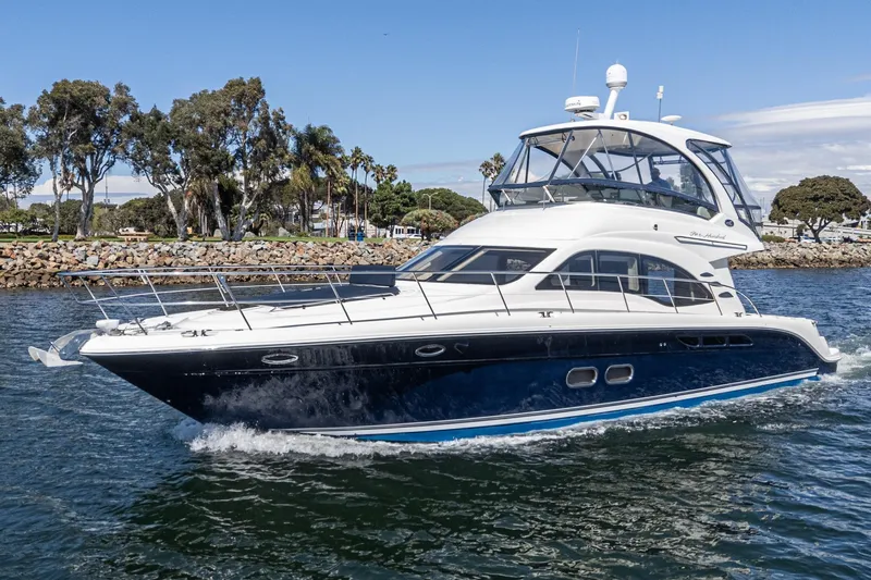  Yacht Photos Pics 2005 Sea Ray 500 Sedan Bridge yacht cruising on a sunny day.