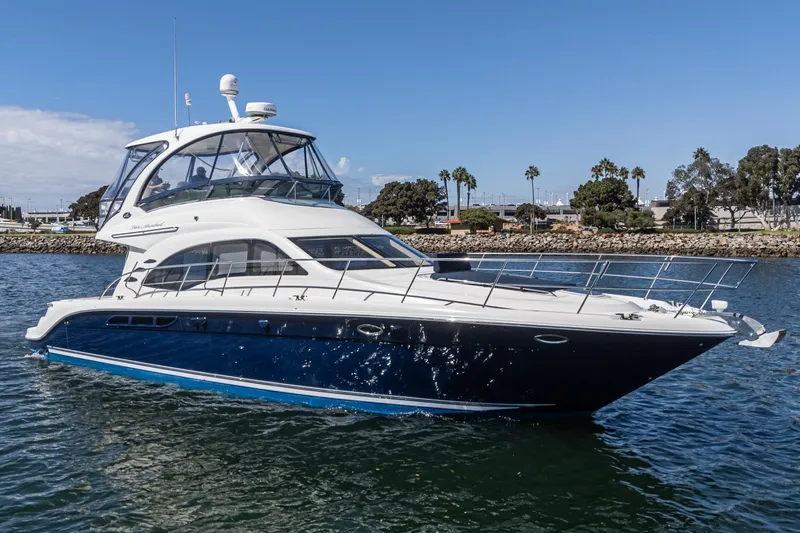  Yacht Photos Pics 2005 Sea Ray 500 Sedan Bridge yacht cruising on a sunny day.