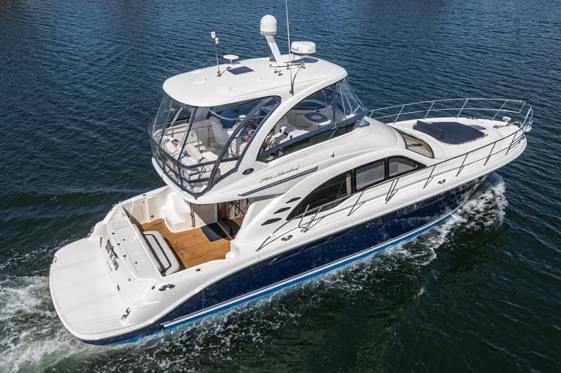  Yacht Photos Pics 2005 Sea Ray 500 Sedan Bridge yacht cruising on open water.