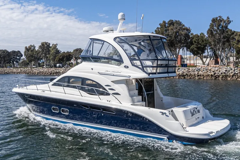  Yacht Photos Pics 2005 Sea Ray 500 Sedan Bridge yacht cruising on a sunny day.