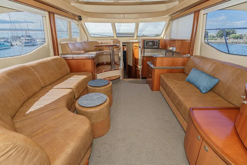  Yacht Photos Pics Luxurious interior of 2005 Sea Ray 500 Sedan Bridge yacht with spacious seating and modern amenities.