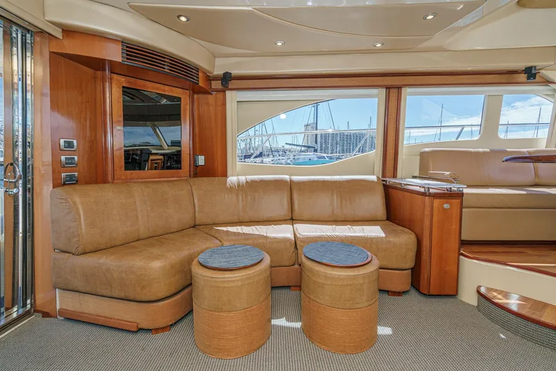  Yacht Photos Pics Luxurious interior of 2005 Sea Ray 500 Sedan Bridge yacht with leather seating and elegant design.