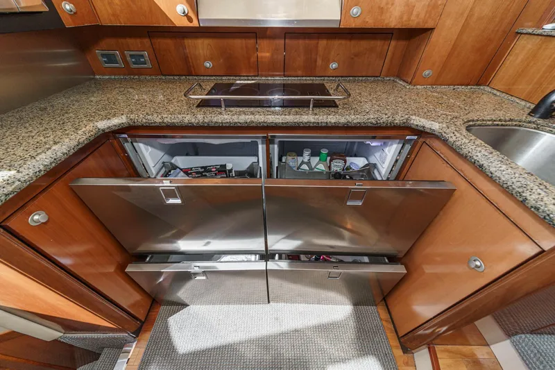  Yacht Photos Pics Luxury kitchen in 2005 Sea Ray 500 Sedan Bridge yacht with open stainless steel fridge.