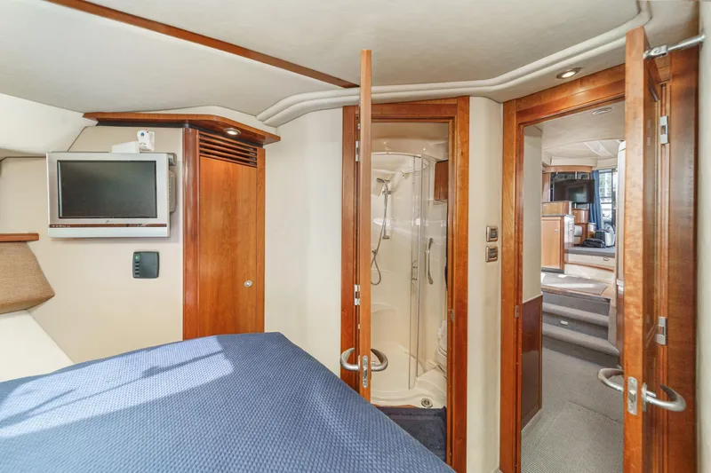  Yacht Photos Pics Luxurious 2005 Sea Ray 500 Sedan Bridge interior with cozy bedroom and modern amenities.