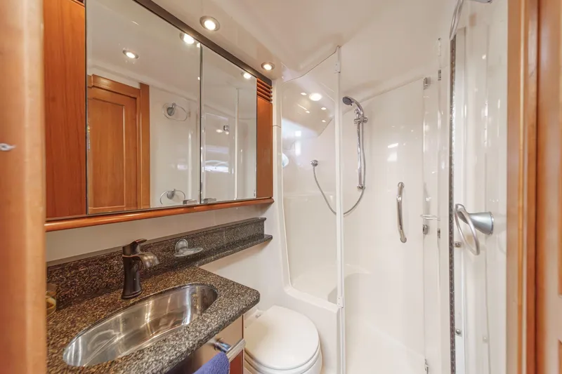  Yacht Photos Pics Luxurious bathroom in 2005 Sea Ray 500 Sedan Bridge yacht with modern fixtures.