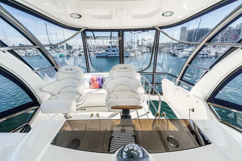  Yacht Photos Pics Luxurious 2005 Sea Ray 500 Sedan Bridge yacht interior with panoramic marina view.
