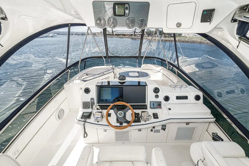  Yacht Photos Pics 2005 Sea Ray 500 Sedan Bridge helm with modern navigation equipment and panoramic water views.