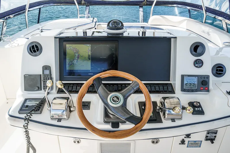  Yacht Photos Pics Cockpit of 2005 Sea Ray 500 Sedan Bridge with navigation controls and steering wheel.