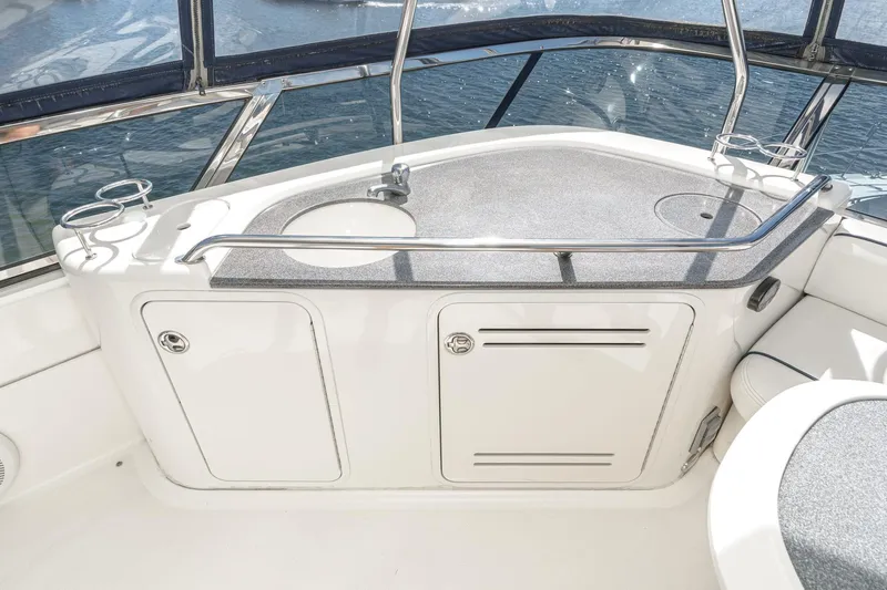  Yacht Photos Pics 2005 Sea Ray 500 Sedan Bridge yacht interior with sink and storage cabinets.