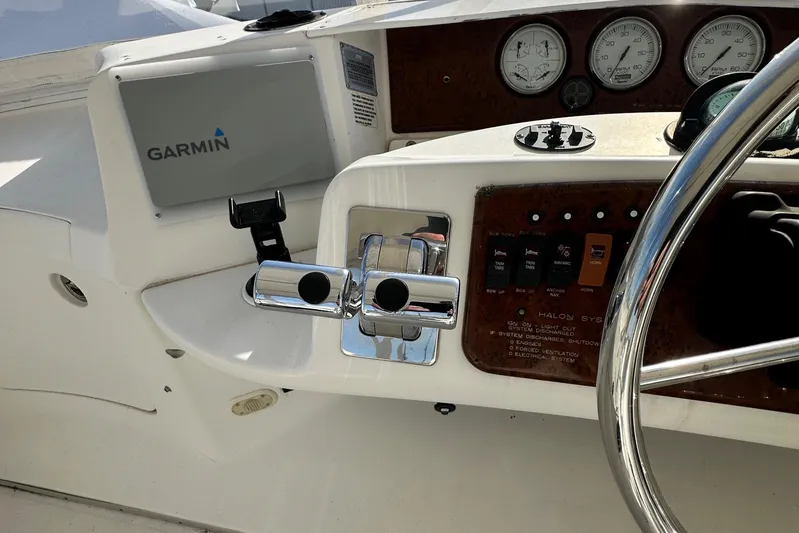 "fish N Chicks" Yacht Photos Pics 2005 Silverton 34 Convertible boat dashboard with Garmin GPS and control panel.