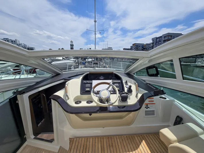 Rio Yacht Photos Pics Helm of 2019 Beneteau Gran Turismo 40 yacht with modern controls and panoramic view.