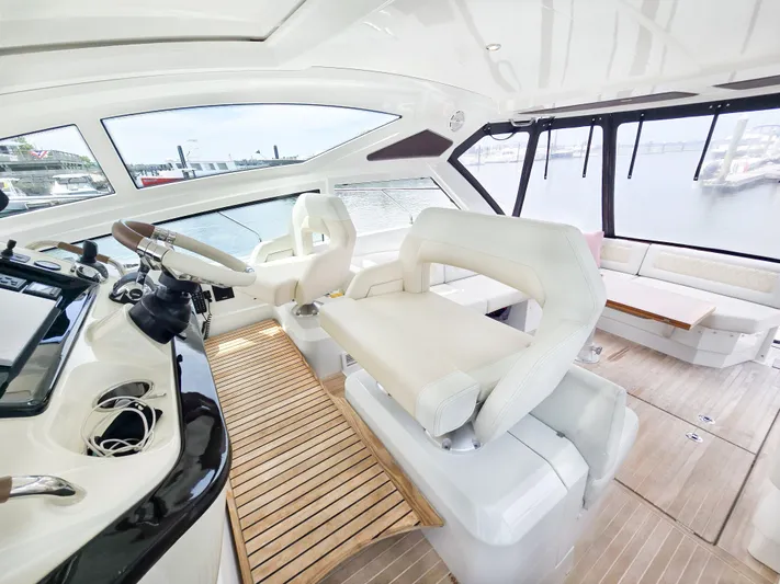 Rio Yacht Photos Pics Luxurious interior of 2019 Beneteau Gran Turismo 40 yacht with modern helm and seating.