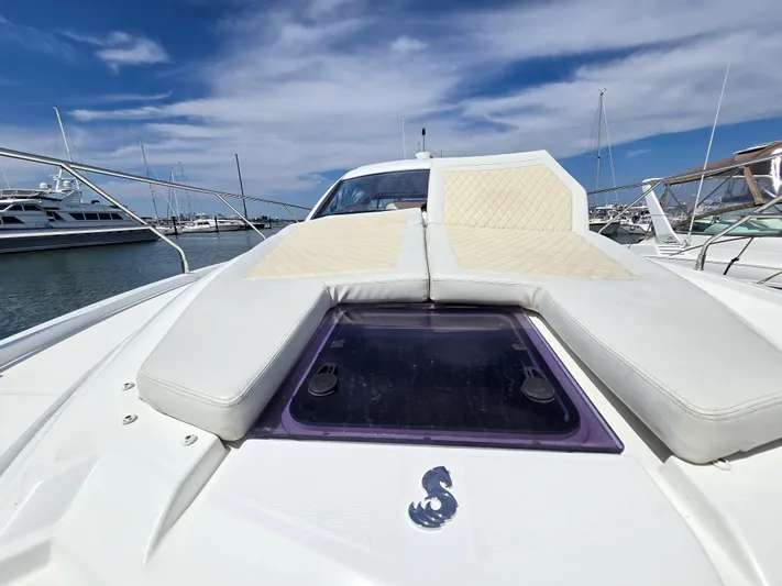 Rio Yacht Photos Pics 2019 Beneteau Gran Turismo 40 yacht with sunbathing deck, docked in a marina under blue skies.