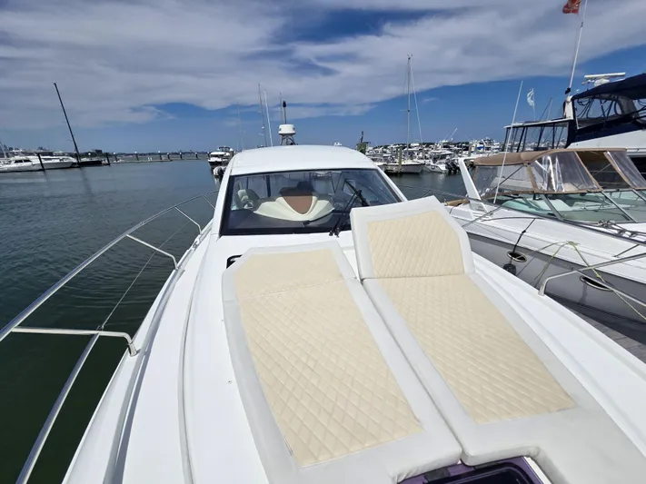 Rio Yacht Photos Pics 2019 Beneteau Gran Turismo 40 yacht with sun loungers, docked in a marina.