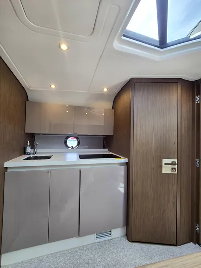 Rio Yacht Photos Pics 2019 Beneteau Gran Turismo 40 interior with modern kitchenette and skylight.