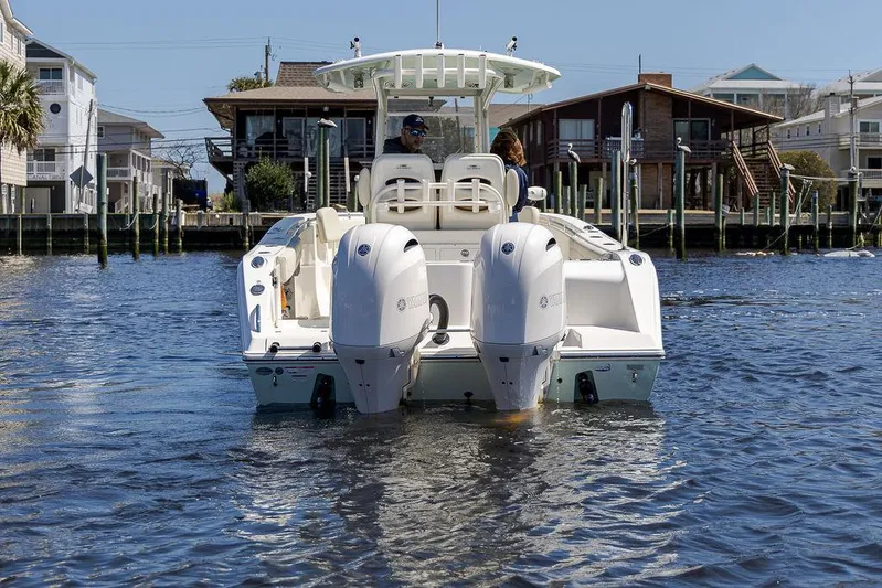 Compass Rose Yacht Photos Pics 2020 Cobia 280 Center Console boat on water, rear view with dual engines.