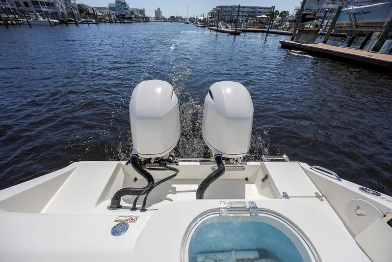 Compass Rose Yacht Photos Pics 2020 Cobia 280 Center Console boat with dual engines on a calm waterway.