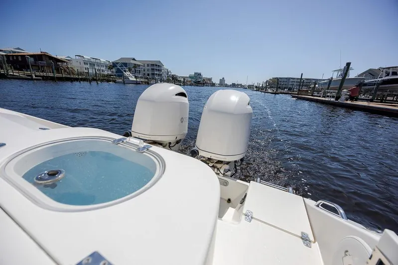 Compass Rose Yacht Photos Pics 2020 Cobia 280 Center Console boat with dual engines on a sunny day.