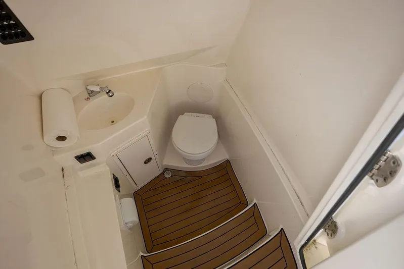 Compass Rose Yacht Photos Pics 2020 Cobia 280 Center Console boat bathroom with sink and toilet.