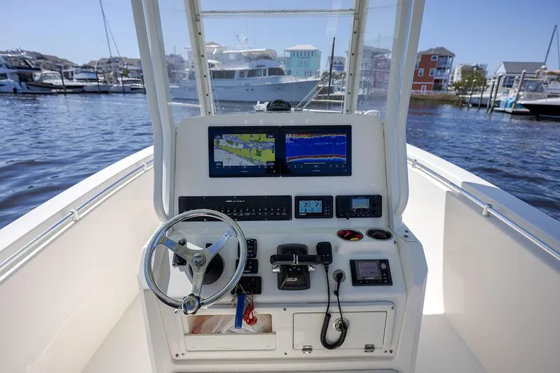 Compass Rose Yacht Photos Pics 2020 Cobia 280 Center Console boat dashboard with navigation screens and controls.