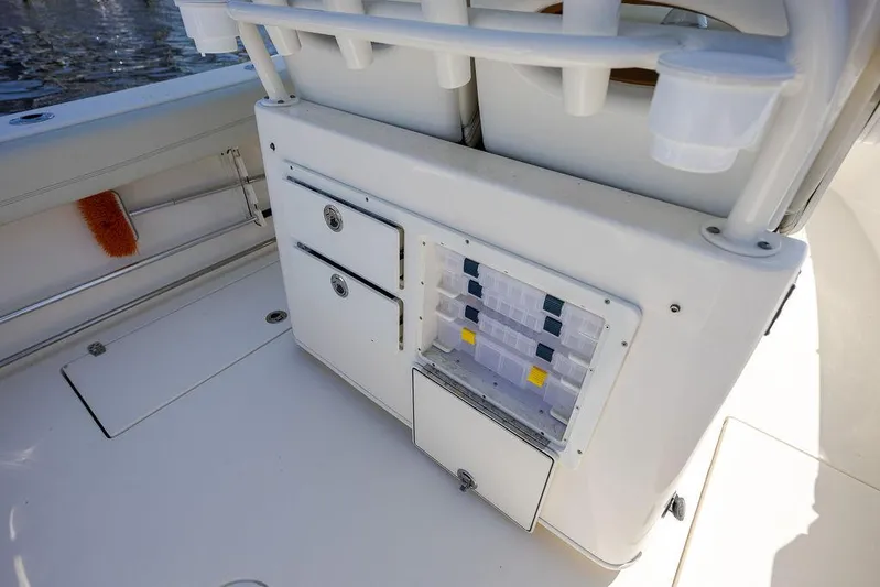 Compass Rose Yacht Photos Pics 2020 Cobia 280 Center Console boat storage area with drawers and tackle box.