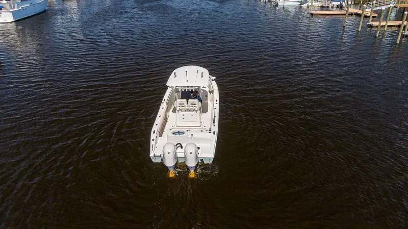 Compass Rose Yacht Photos Pics 2020 Cobia 280 Center Console boat on open water, rear view.