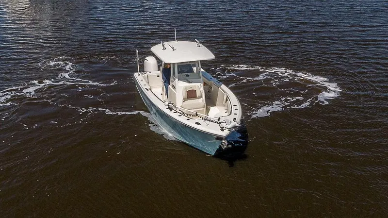 Compass Rose Yacht Photos Pics 2020 Cobia 280 Center Console boat navigating on open water.