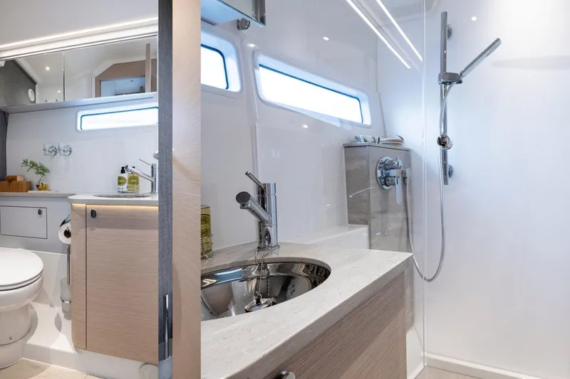  Yacht Photos Pics Luxurious bathroom interior of 2026 Nimbus 495 Flybridge yacht, featuring modern fixtures and elegant design.