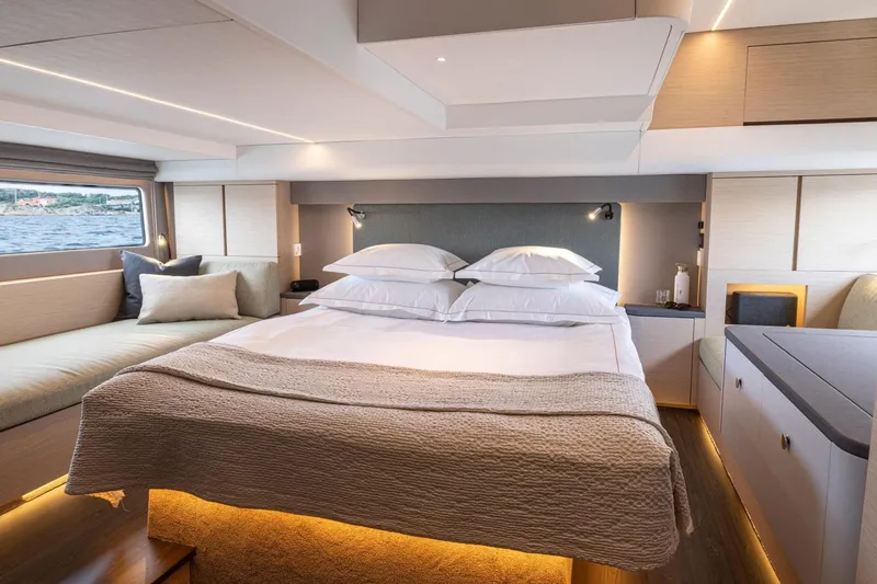  Yacht Photos Pics Luxurious interior of 2026 Nimbus 495 Flybridge yacht with elegant bedroom design.