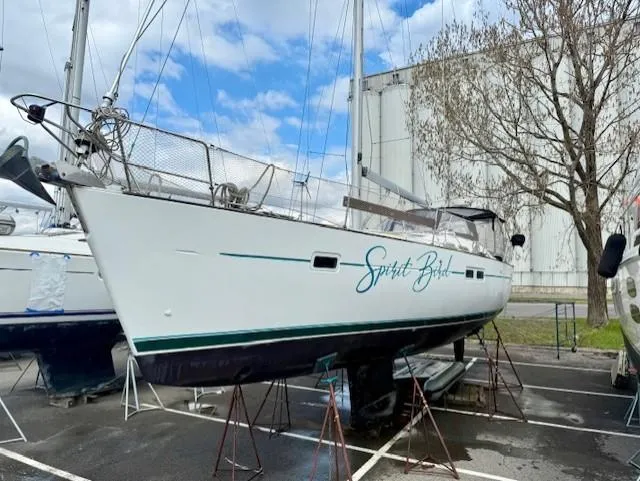 Spirit Bird Yacht Photos Pics 2004 Beneteau Oceanis 423 sailboat on stands, named "Spirit Bird," in a boatyard.