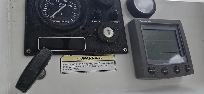 Spirit Bird Yacht Photos Pics Control panel of a 2004 Beneteau Oceanis 423 sailboat with warning label and gauges.