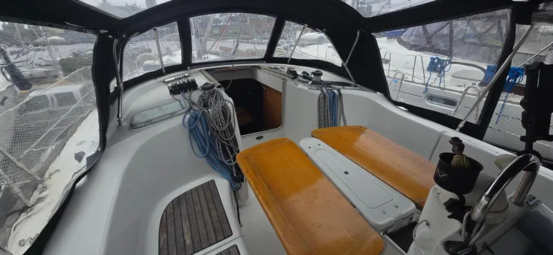 Spirit Bird Yacht Photos Pics Cockpit of 2004 Beneteau Oceanis 423 sailboat with seating and navigation equipment.