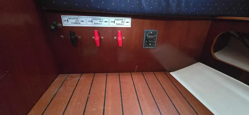 Spirit Bird Yacht Photos Pics Control panel on 2004 Beneteau Oceanis 423 sailboat with wooden interior.