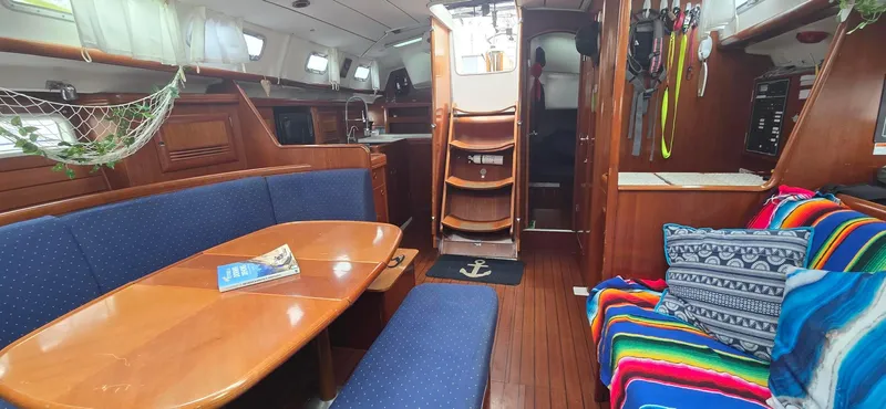 Spirit Bird Yacht Photos Pics Interior of 2004 Beneteau Oceanis 423 sailboat with cozy seating and colorful decor.
