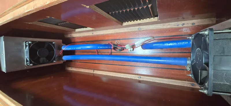 Spirit Bird Yacht Photos Pics Ventilation system inside a 2004 Beneteau Oceanis 423 yacht, featuring blue hoses and fans.