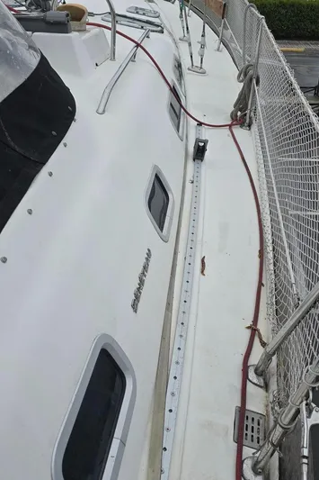 Spirit Bird Yacht Photos Pics 2004 Beneteau Oceanis 423 sailboat deck with safety netting and windows.